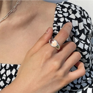 Minimalist S925 sterling silver ring with oval pink gemstone worn by female model