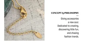 Detail of 18K gold plated chain with lobster clasp and K18 hallmark tag on emerald necklace