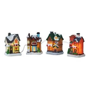 Détail de maisons miniatures de Noël en résine avec LED, comprenant café et glacier