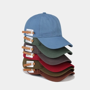 Detailed view of the vintage cotton baseball caps with unique side leather labels