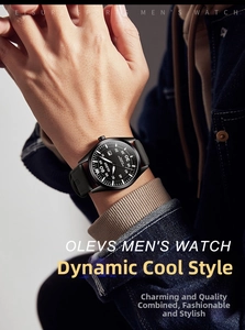 Detail of OLEVS quartz watch featuring a black leather strap and calendar display