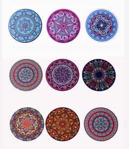 Detailed view of nine unique mandala patterns on round DIY diamond painting coasters
