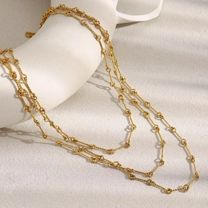 Minimalist multi-layered 18K gold plated stainless steel necklace on white display