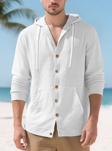 Detail of white cotton linen hooded shirt with wood buttons and a kangaroo pocket