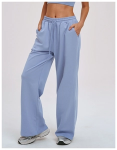 Detail showing the elastic waistband with adjustable drawstring on light blue joggers
