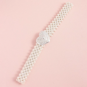 Detail of elegant multi-row pearl waist belt with heart shaped silver metal buckle