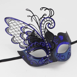 Detail of laser-cut butterfly mask featuring blue glitter accents and crystal rhinestones