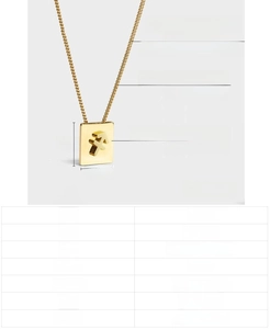 Macro detail of golden Sagittarius pendant showing dimensions 14mm by 12mm and 1.5mm thickness