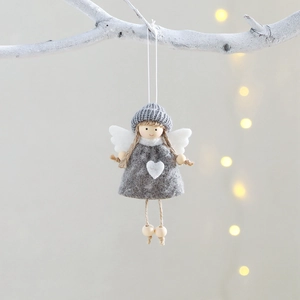 Handmade Christmas angel doll ornament with grey felt dress and white heart on a branch