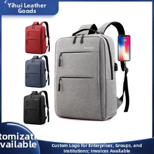 Business laptop backpack detail showing USB charging port and color options in grey and blue