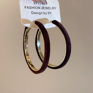 Macro view of dark brown flocked round hoop earrings with S925 silver needles