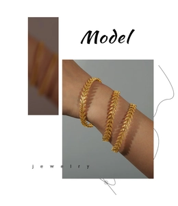 Detailed view of three-piece gold-plated leaf texture bracelets with intricate engravings