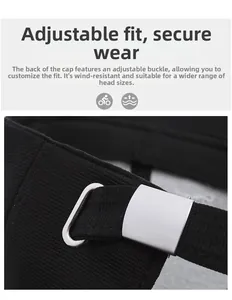 Detail view of the black baseball cap showing the adjustable silver metal buckle closure