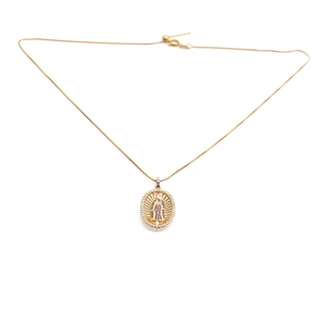 Golden necklace with oval Virgin Mary pendant surrounded by pink gems and clear zircon