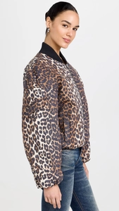 Detailed view of women's leopard print bomber jacket featuring black ribbed knit cuffs and collar