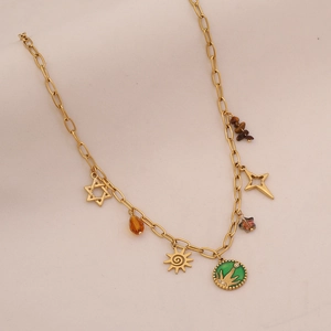 Detail of gold chain necklace featuring star, sun, and colorful beads pendants