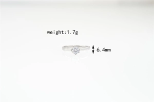 Detail view of 6.4mm moissanite ring with six-prong setting weighing 1.7g
