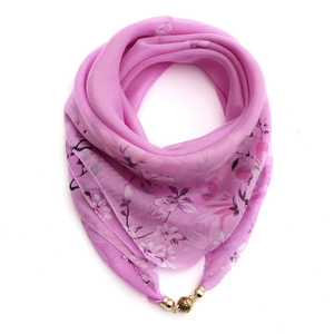 Detail view of pink floral chiffon silk scarf with a golden magnetic clasp closure