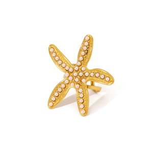 Gold-plated stainless steel starfish ring with white pearls on a clean white background