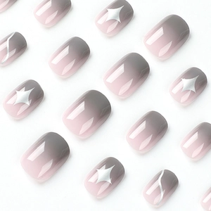 Pink and grey gradient press-on nails with silver star motifs and glossy finish