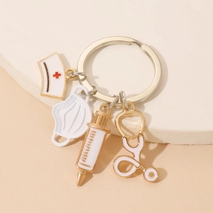 Detail of medical theme keychain with nurse hat, stethoscope, and syringe charms