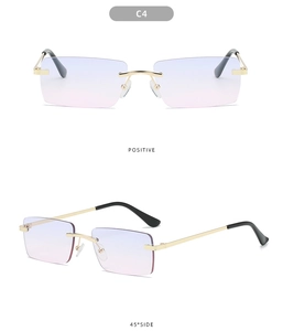 Close-up of rimless square sunglasses with blue-pink gradient lenses and gold frames