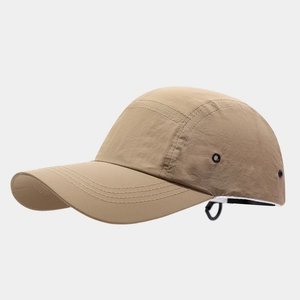 Detail of khaki quick-dry baseball cap featuring metal eyelets and adjustable buckle strap