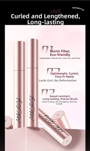 Close-up of rose gold mascara tube showing fine comb brush and waterproof formula texture