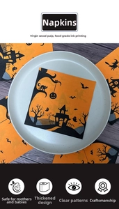Detail of Halloween napkins with pumpkin and castle prints made of virgin wood pulp