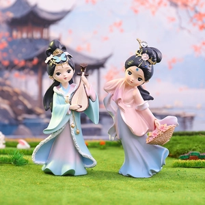 Detail of miniature ancient Chinese figures holding a lute and a flower basket