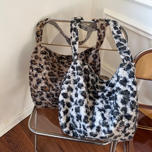 Macro detail of plush leopard print faux fur texture on premium large tote bags