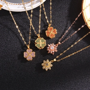 Rotating four-leaf clover necklaces with zircon in purple green and orange gold finishes