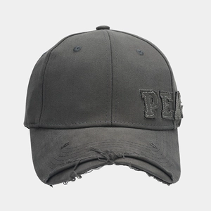 Detail of distressed brim and premium PEA patch embroidery on dark grey cotton cap