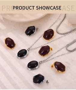 Detail of luxury enamel jewelry set with necklaces and earrings on stone background