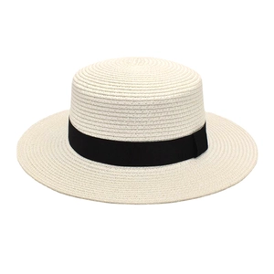 Elegant off-white flat-top straw boater hat with a wide black ribbon for sun protection