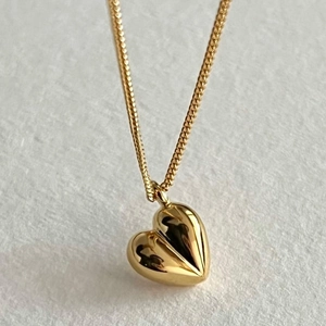Polished 925 sterling silver heart pendant necklace with smooth golden metallic finish