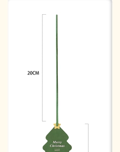 Close-up of a 20cm green Christmas tree topper stick with a gold star and festive text
