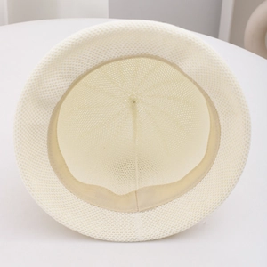 Detail view of cream breathable linen bucket hat with interior sweatband and mesh texture