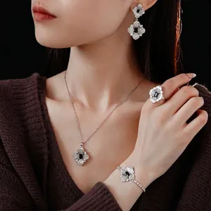 Luxury silver flower jewelry set with black rhombus stones and micro-pave diamonds