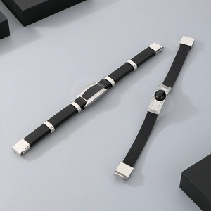 Detail view of double-layer leather bracelets with stainless steel bars and zircon stones