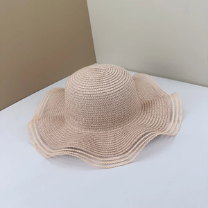 Elegant beige straw sun hat with wavy brim and mesh splicing for beach vacation style
