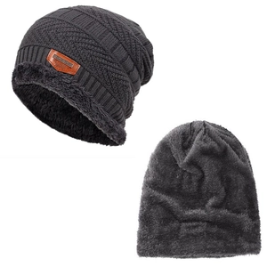 Close-up of charcoal grey knit beanie showing thick fleece lining and leather label