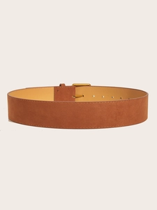 Detail view of brown suede wide belt with a polished gold geometric metal buckle