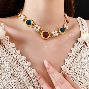 Vintage jewelry set with faux pearls and red-blue gems necklace worn by a female model