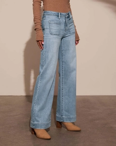 Detail view of high-waist light blue wide-leg jeans with front utility pockets