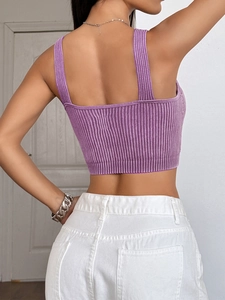 Detail of purple ribbed knit crop top back view showing texture and snug fit