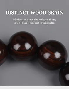 Macro detail of natural wood grain on polished dark ebony sandalwood prayer beads