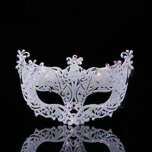 Silver venetian lace masquerade mask with glitter and sequins on a black background