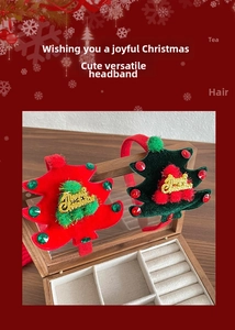 Detail of velvet Christmas tree headbands with Merry Christmas text and colorful beads