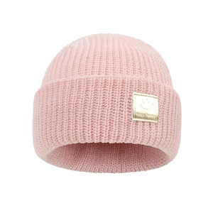Close-up of pink ribbed knit beanie with a golden Happy Beanies smiley face patch